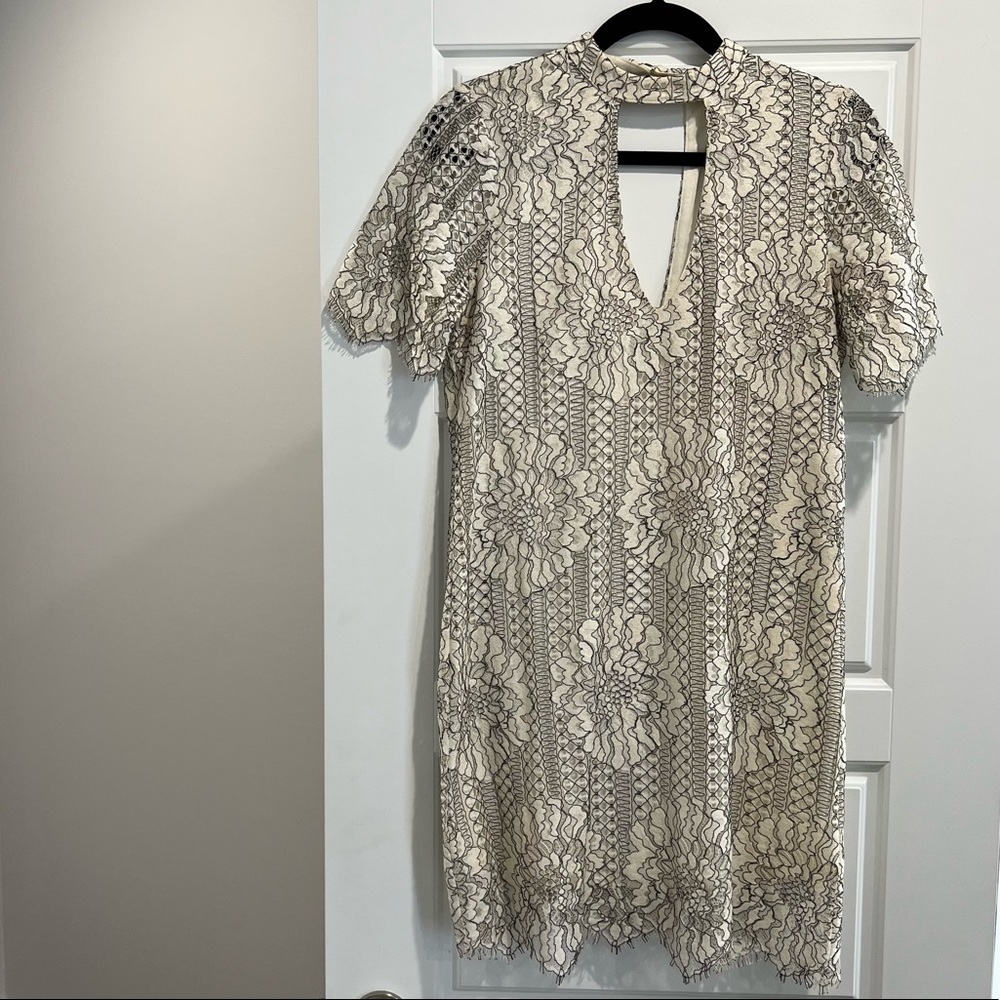 Black and white lace dress with front cutout